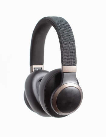 Black audio headphones isolated on white background. close-up