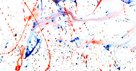 Drops of red and blue paint on a white background. Abstraction