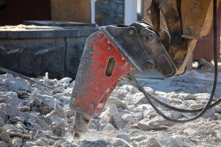 Jackhammer machine breaks concrete in the city.の写真素材