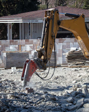 Jackhammer machine breaks concrete in the city.の写真素材