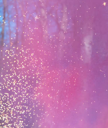 Red smoke with firework sparks in nature during the day.