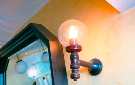 Sconce lighting fixture on the wall in the room