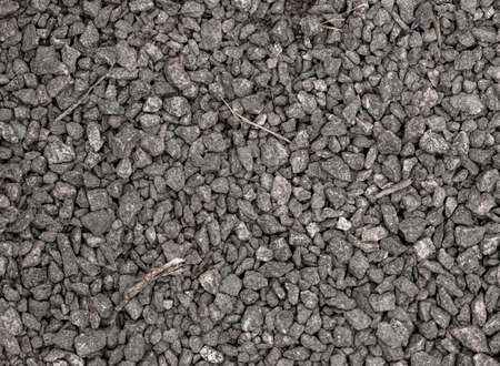 Small pebbles of crushed stone as an abstract background. Texture