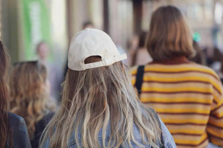 People walk down the street in the city during the dayの写真素材
