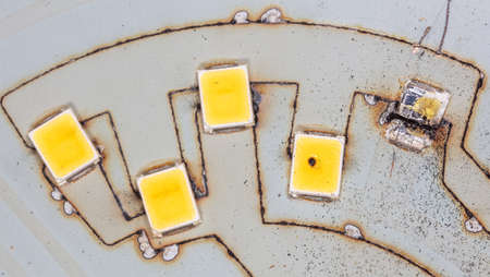 Burnt out LEDs on a disassembled LED lamp. Macro