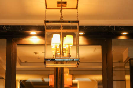 The lantern glows indoors at night.の写真素材