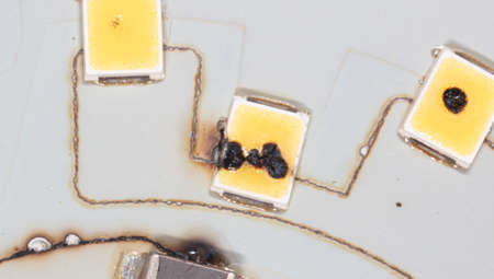 Burnt out LEDs on a disassembled LED lamp. Macro