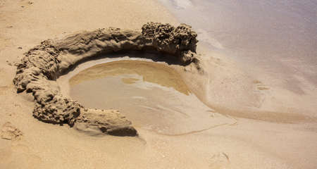 Sand towers on the seashore.