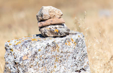 Ancient stones stacked in a wall in natureの写真素材