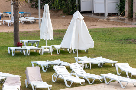 Sunbeds and deck chairs by the pool. relaxationの写真素材