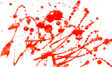 Drops of red paint on a white background. Close-up