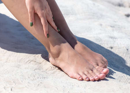 Feet of a girl on a white limestone volcanic rock. Natureの写真素材