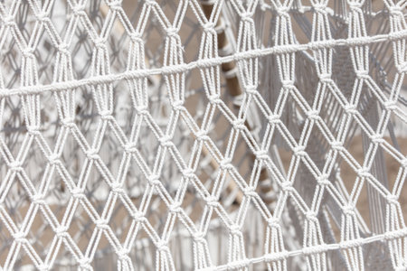 Weaving from white thread as an abstract background. Texture