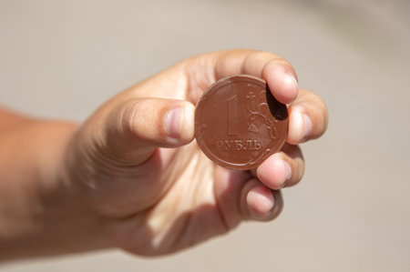 One chocolate ruble in hand.の写真素材
