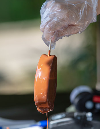 Cooking chocolate ice cream in the park. close-upの写真素材
