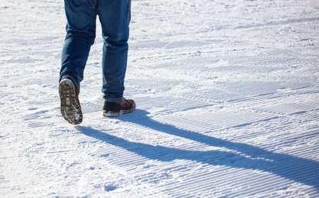 A man walks in the snow. Winter