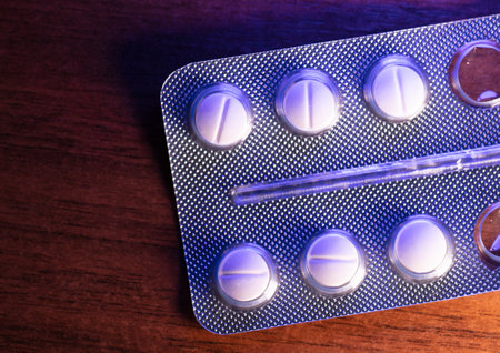 Pills on the table in blue-pink color. close-upの写真素材