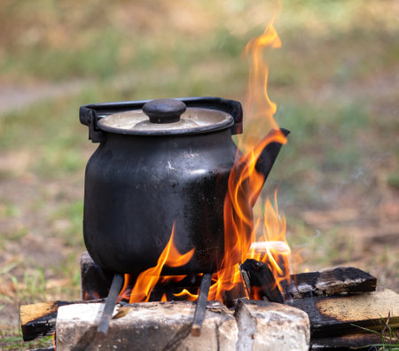 Kettle on a campfire in nature.