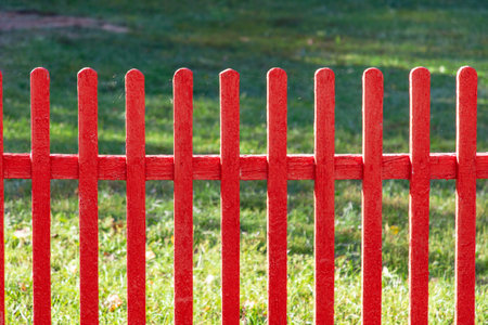 Wooden fence painted with red paint. backgroundの写真素材