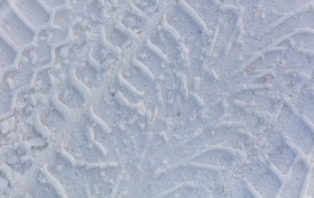 Traces from the car in the snow as a background. Winterの写真素材