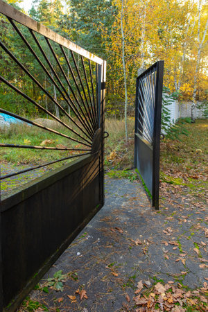 Metal gates in the park in autumn.