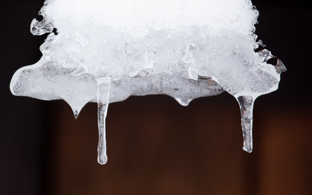 An icicle hangs from the snow. Winterの写真素材