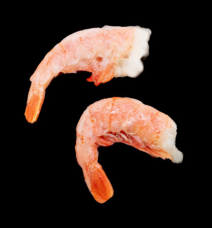Shrimp tails isolated on black background. close-upの写真素材