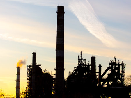 Pipes at the plant against the backdrop of the sunset.の写真素材
