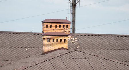 Old pipe on the roof of the house.の写真素材