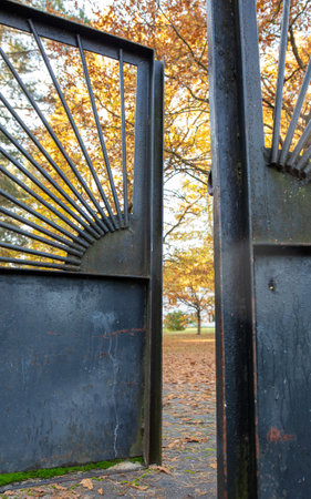 Metal gates in the park in autumn.
