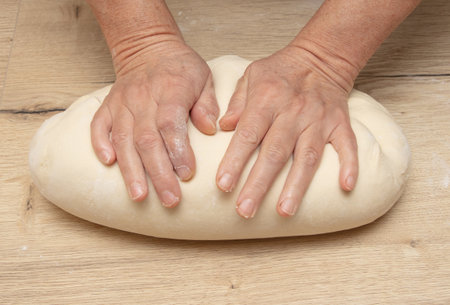 Hand kneading flour dough. cooking food