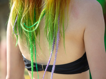 Green hair on the girl's head. close-up.の写真素材
