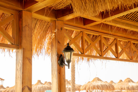 Sconce lamp on a wooden pole in a cafeの写真素材