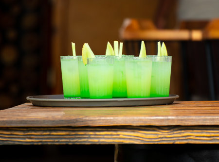 Green juicy cocktail with melon in a cafe.の写真素材