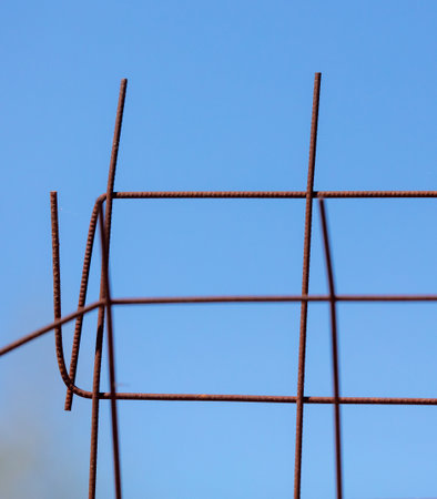 Old rusty metal grating against the blue skyの写真素材