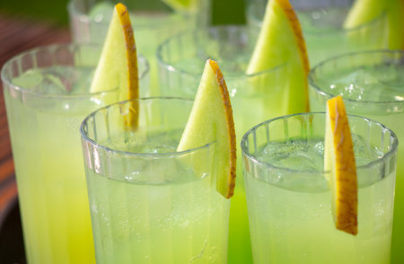 Green juicy cocktail with melon in a cafe.の写真素材