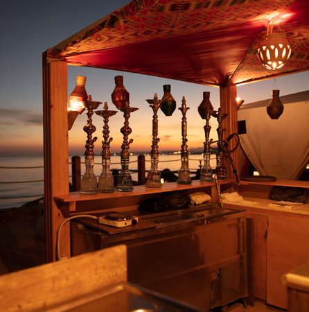 Hookahs in a cafe at sunset.