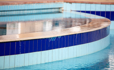 Swimming pool with blue water as a background.