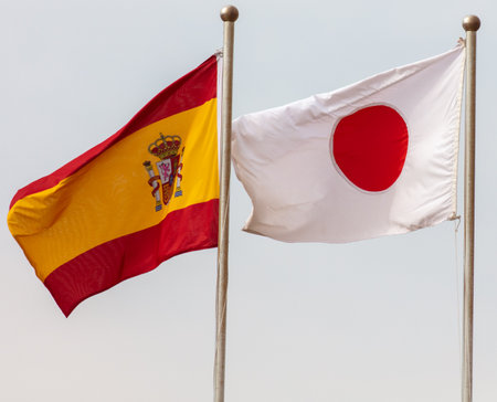 Flags of Japan and Spain against the sky. symbolの写真素材