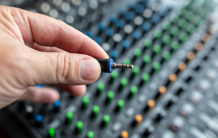 Microphones Jack hand at the music console. technologiesの写真素材