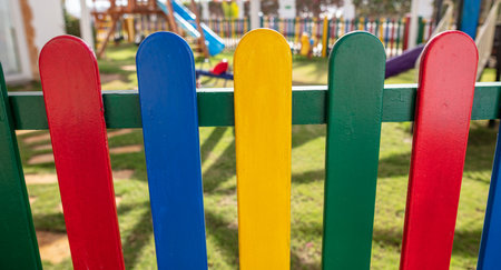 Colorful fence on the playground in the park.の写真素材