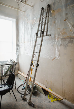 Repair in a room with a ladder against the wall.の写真素材