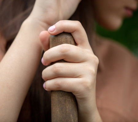 Girl's hands on the handle of a shovel. close-upの写真素材