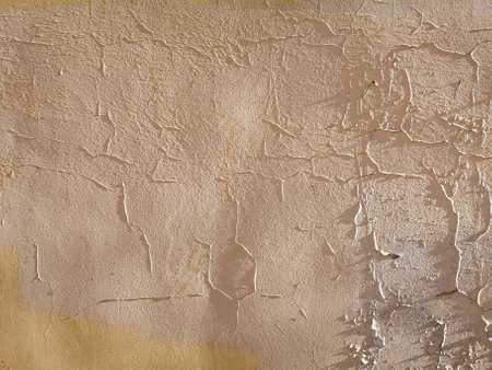 Cracked plaster on the wall of the house as an abstract background. texture.の写真素材