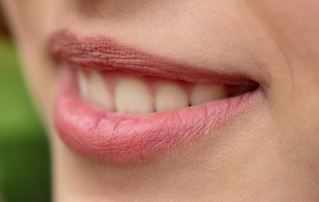 Lips of a young smiling girl as a background. Macroの写真素材
