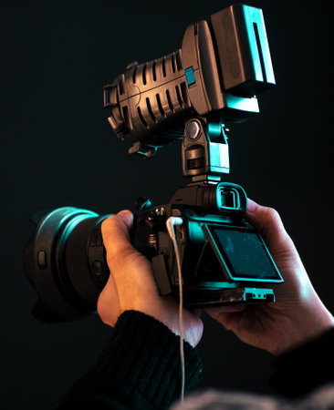 Video camera in the hands of a man. close-upの写真素材