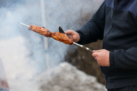 Cooking meat skewers on skewers on the grill.の写真素材