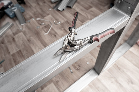 Scissors tool for cutting metal at a construction site.の写真素材
