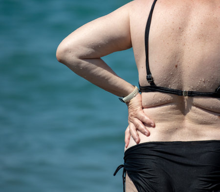 Grandmother in a bathing suit on the sea.