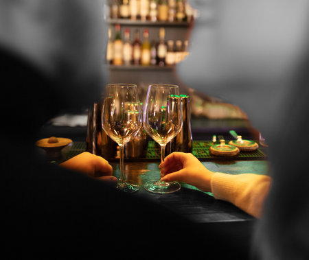 Couple in love with glasses of champagne in a cafe.の写真素材